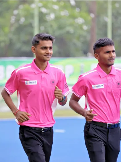 Two of our young officials jogging on the field, ready for their duties. We are proud to see our members representing us at national-level tournaments.