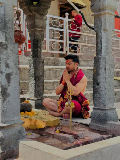 In prayer at a temple. My faith is my anchor, providing strength and clarity in both my personal and professional life.