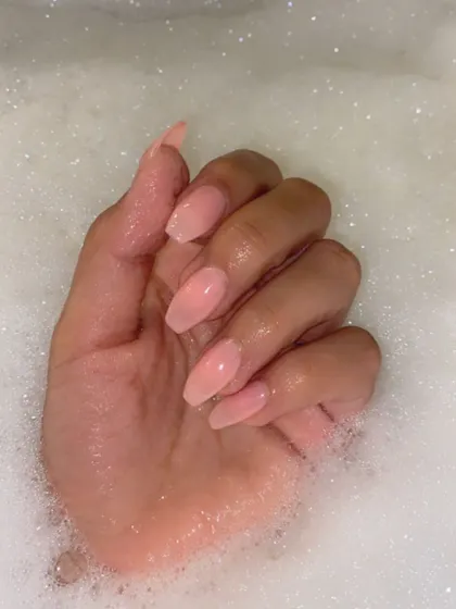 This client is giving us major nail goals with her simple, elegant nude-pink press-on nails. This is a timeless and versatile look that suits any occasion.