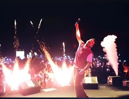 A high-energy moment with pyrotechnics firing on stage at IIM Indore.