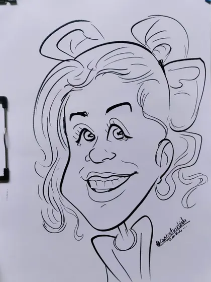 She looks so cute, yes or no? A fun caricature with a big bow in her hair.