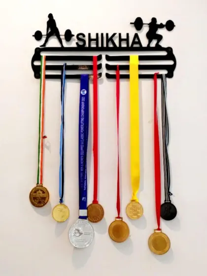 Each medal on this hanger tells a story of hard work and dedication. I help my clients write their own success stories.