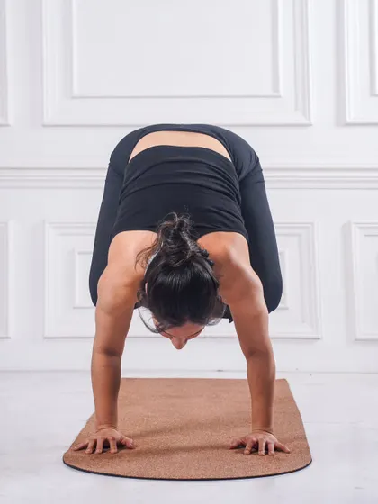Getting into Kakasana (Crow Pose). This is often the first arm balance yogis learn, building foundational strength in the arms and core, and teaching us to trust ourselves.
