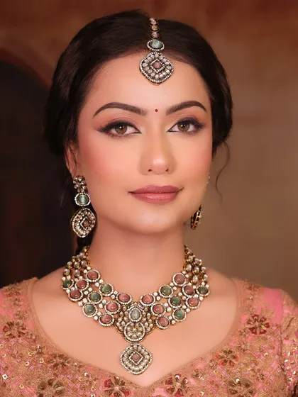 This is the essence of my artistry, a look I call 'Sundar'. It’s about creating flawless, radiant skin and defining the eyes with a classic winged liner, allowing your natural beauty to be the focus. This is a perfect example of a timeless engagement or reception look.