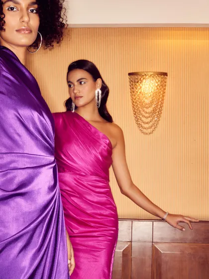 A dual-model shot for a party wear brand, showcasing two jewel-toned dresses. My direction focused on creating a sense of glamour and friendship, perfect for the brand's target audience.