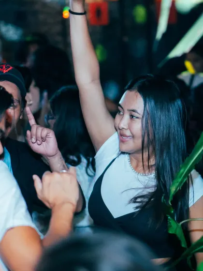Another happy face in the crowd, pointing up in appreciation. The connection with the audience is everything.