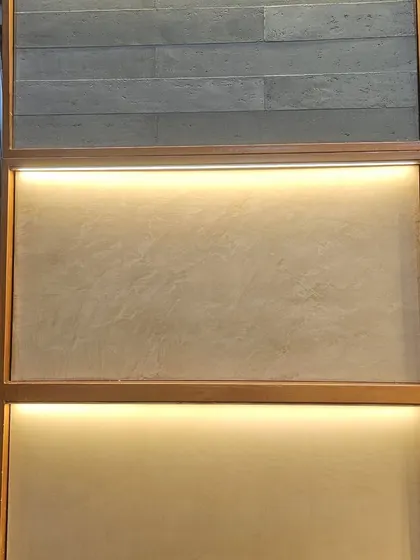 The 'Origins' series, featuring finishes that look like slate tiles and smooth micro-concrete. These offer a minimalist and sophisticated aesthetic.