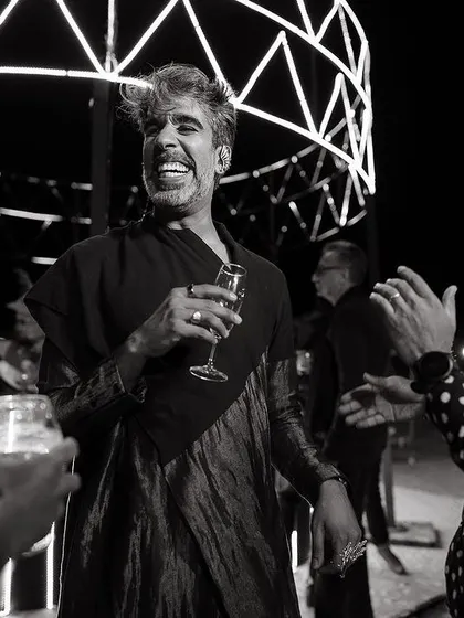 The joy of a great party, even in the middle of the desert. We create the atmosphere, and the guests bring the energy. This black and white shot captures the fun and laughter of the welcome dinner.