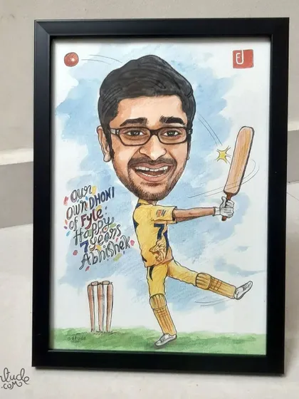 Another shot of the framed cricket-themed caricature, showing the vibrant colors and personalized message.