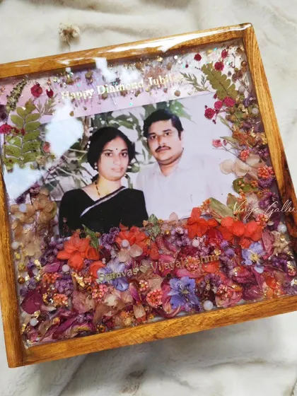 A perfect blend of nature's elegance and special moments. This floral frame was created to celebrate a 60th birthday anniversary, with the theme "May their love bloom forever."