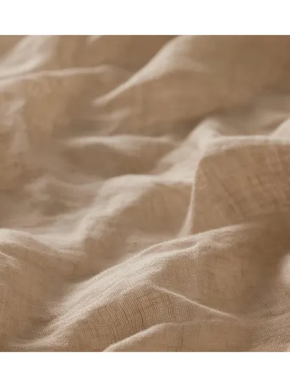 Natural fabrics like this 'Tiamo' textile are always on trend. Its soft, crinkled texture is ideal for drapery, creating chic, relaxed interiors in living rooms or bedrooms.