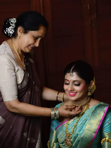 A mother's loving touch as she helps her daughter get ready. These are the cherished memories that make a wedding day so special.