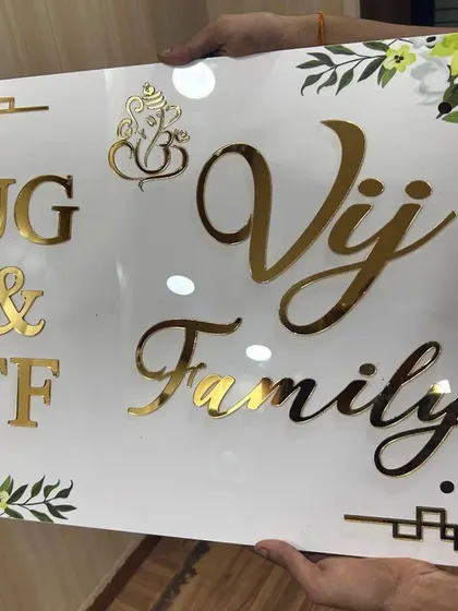 An elegant acrylic nameplate for the 'Vij Family.' This design combines golden letters with a beautiful floral print border.