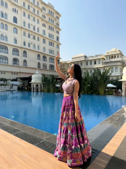 A majestic shot by the pool, with the grand hotel in the background. This shows how I can model for destination wedding campaigns.