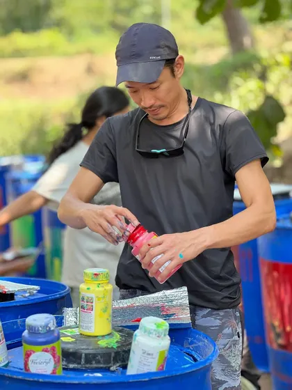 Participants getting ready to paint at an outdoor festival. The anticipation and excitement before starting a new piece is always wonderful to see.