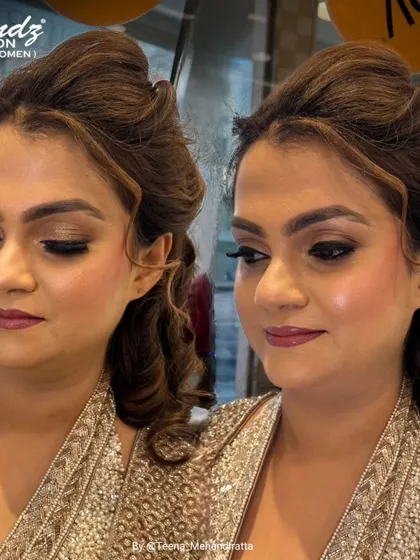 This is a beautiful example of soft glam party makeup. The look focuses on a neutral smokey eye, subtly defined features, and a berry-toned lip for an effortlessly elegant finish.
