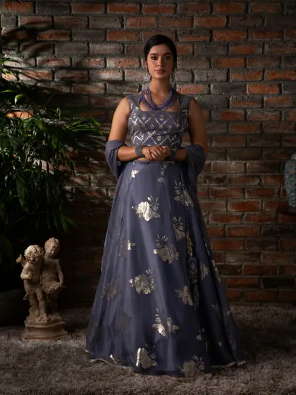 Let my couture creations adorn your special occasions. This lavender lehenga with silver foil work and a unique halter-neck blouse is perfect for a modern festive look.