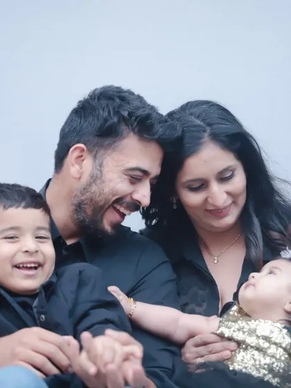 The color version of the previous shot, showing the family's happy and loving interaction in the studio.