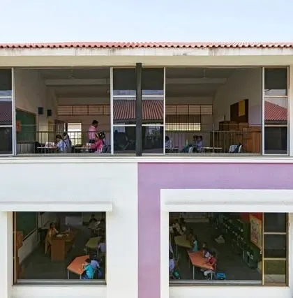A view across classrooms at Sparkrill International School. The design emphasizes transparency and connection, with large windows and open corridors that allow learning to be visible and accessible, breaking down the barriers of the traditional classroom box.
