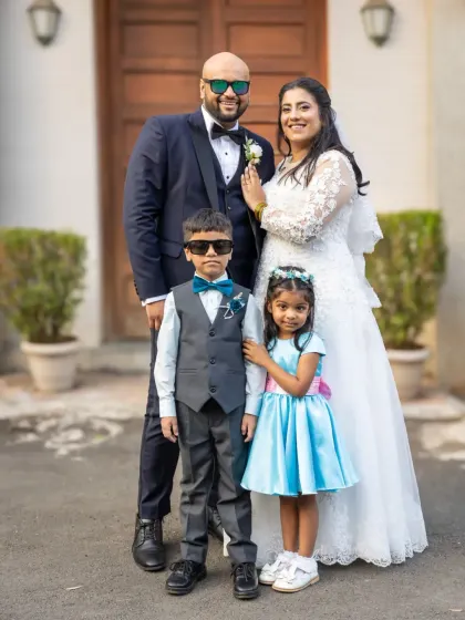 A wedding is a family affair. This adorable portrait of the couple with their page boy and flower girl is one for the family album. So much style in one photo.