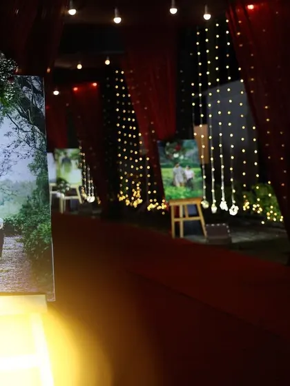 To personalize the entrance walkway, I placed large, beautifully lit portraits of the couple on easels along the path. This is a lovely way to share their story with guests as they arrive.