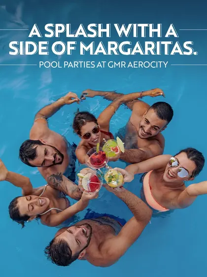 A splash with a side of margaritas. This fun image of friends toasting in a pool showcases the exciting pool parties and refreshing drinks you can enjoy here.