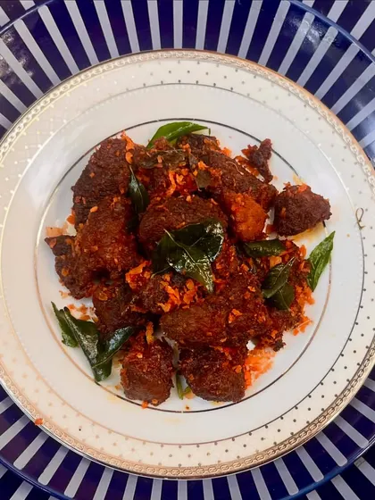 Angamaly Pork, a legendary dish recreated for our Christmas menu. Slow-cooked in a manchatti, this pork fry is infused with bold masalas and a hint of vinegar for a truly authentic taste.
