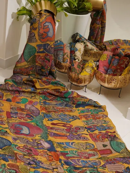 This is a glimpse into my Kalamkari Edition, featuring a wide array of hand-painted dupattas and fabrics from the Indralokam series. Each piece is a unique story, available for you to customize into your dream outfit.