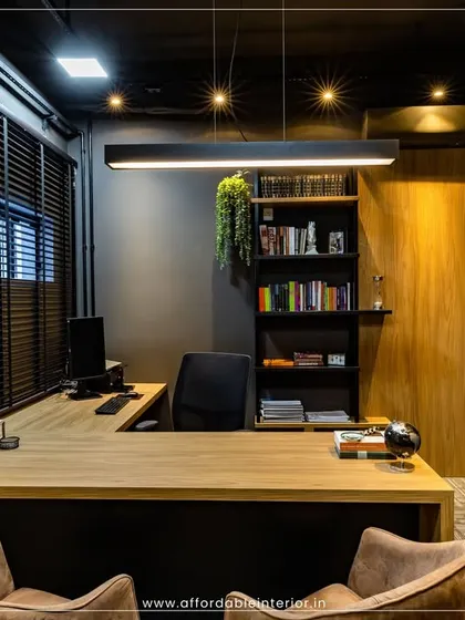 A glimpse into a high-end office cabin we designed in BKC, Mumbai. The design features dark, moody tones, a statement pendant light, and an efficient L-shaped desk, proving that professional luxury can be achieved within a budget.
