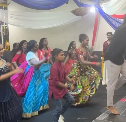 An instructor guiding students through a dance sequence during our Dandiya night. We provide on-the-spot guidance to help everyone feel comfortable.