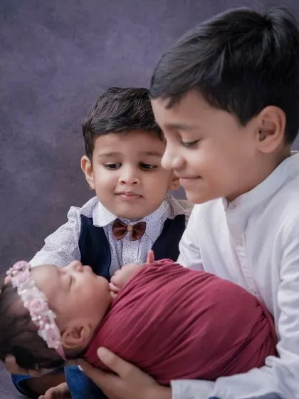 A whole new world of love. Capturing the moment when older siblings meet the newest family member is always a special part of my newborn sessions.