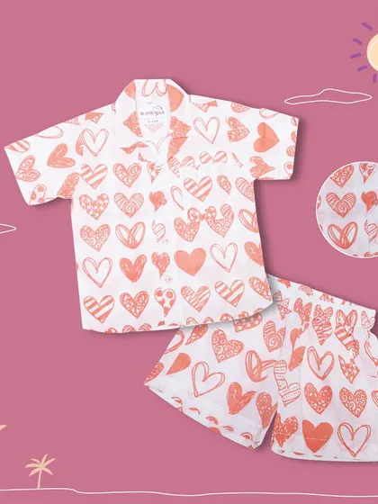 Another look at our orange heart-print co-ord set, a favorite for its bright and cheerful design. It's a perfect example of how I blend fun prints with comfortable, wearable styles.