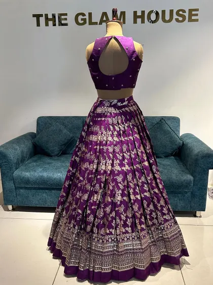 The back of the purple Banarasi lehenga, featuring a chic keyhole cutout on the blouse.