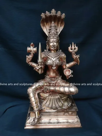An 18-inch Panchaloha sculpture of Mariamman. This larger version allows for greater detail in her expression and the various symbolic items she holds in her multiple hands.