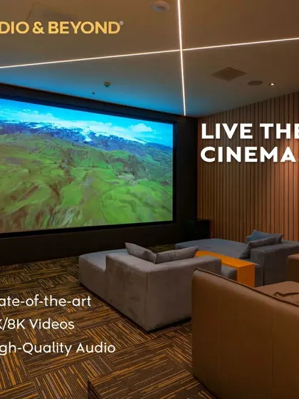 We believe in creating spaces where you can truly live the cinema. This modern media room features a massive 4K screen, plush, comfortable seating, and integrated ceiling lights, all designed to deliver a state-of-the-art, high-quality audio and video experience.