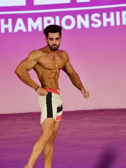 Posing for the judges, making sure every muscle is visible.