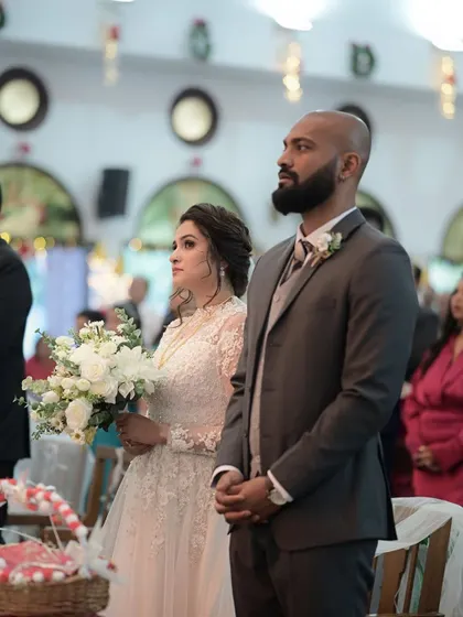 The couple at the altar. I provided light grooming for the groom to ensure he looked sharp and polished next to his stunning bride.