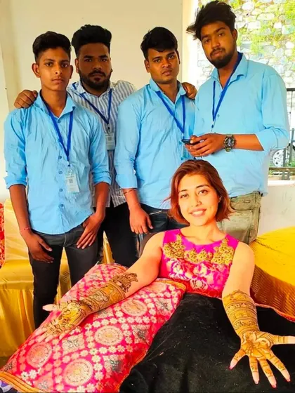 My team and I with a happy client after completing her intricate bridal mehandi. We work together to ensure even the most detailed designs are completed comfortably.
