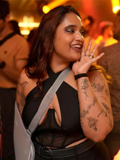 A stylish and happy dancer enjoying the nostalgic tunes.