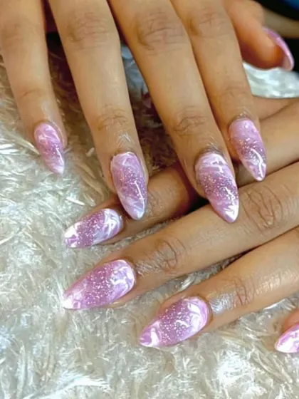 A beautiful marble design using pink and white with a touch of glitter. This creates a rose quartz-like effect that is both elegant and on-trend.