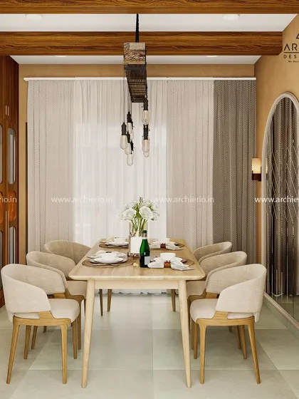 A dining room where rustic charm meets contemporary elegance. The design uses a wooden table and exposed ceiling beam, balanced with modern chairs and lighting.