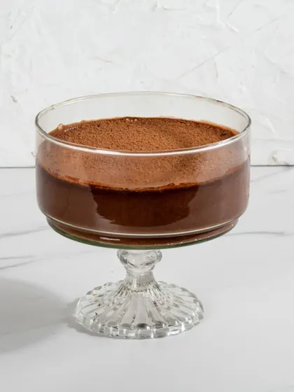 A studio shot of our Dark Chocolate Mousse, emphasizing its deep, rich colour and smooth surface.