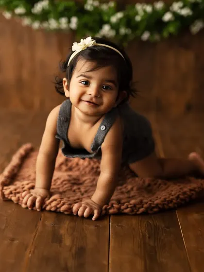 A beautiful crawling pose from a sitter session. This shot captures the determination and sweetness of a baby on the move.