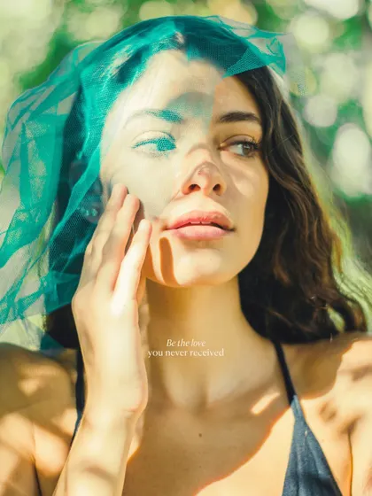 Playing with creative elements like this sheer green fabric to add layers and texture to a portrait. This technique creates a dreamy, ethereal effect, transforming a simple shot into something more artistic.