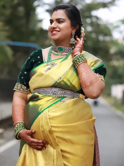 The joy of impending motherhood is beautifully captured in this photo. The client's smile and her sparkling jewellery make for a perfect picture.