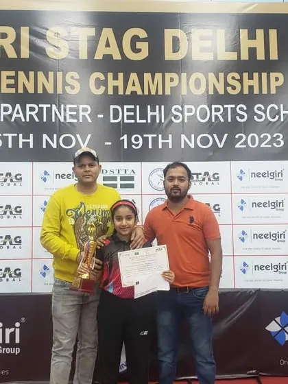 Akanksha Singhal, at just 10 years old, with her coaches after winning Gold in the U-13 Girls category at the Delhi State Championship. Her dominating performance against older opponents was a highlight of the tournament.