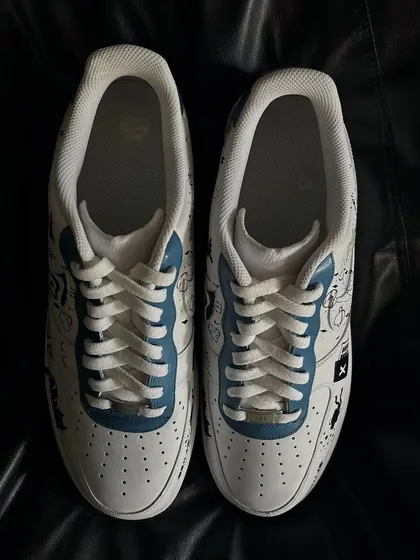 A front view of the personal doodle custom sneakers.