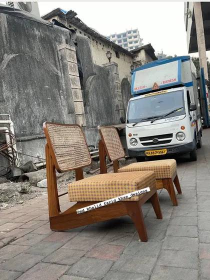 The chairs are shown ready for dispatch, with a delivery truck in the background.