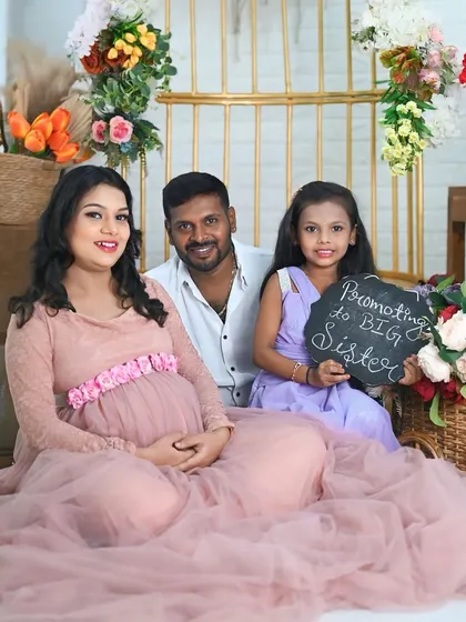 "Promoted to Big Sister." It's pure joy capturing the excitement of a child who is about to welcome a new sibling. These are truly precious family memories.