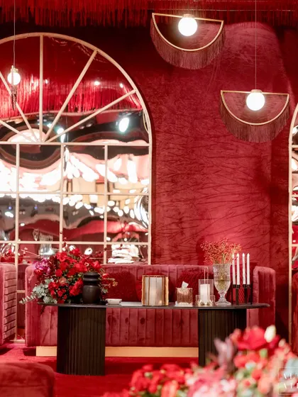 A lounge area at 'Le Rouge', where modern fringe lamps and distorted mirrors play with light and reflection. The design was all about creating the right mood and a sophisticated aesthetic.